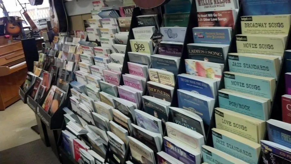 grayscale photography of orchestra playing on theatre