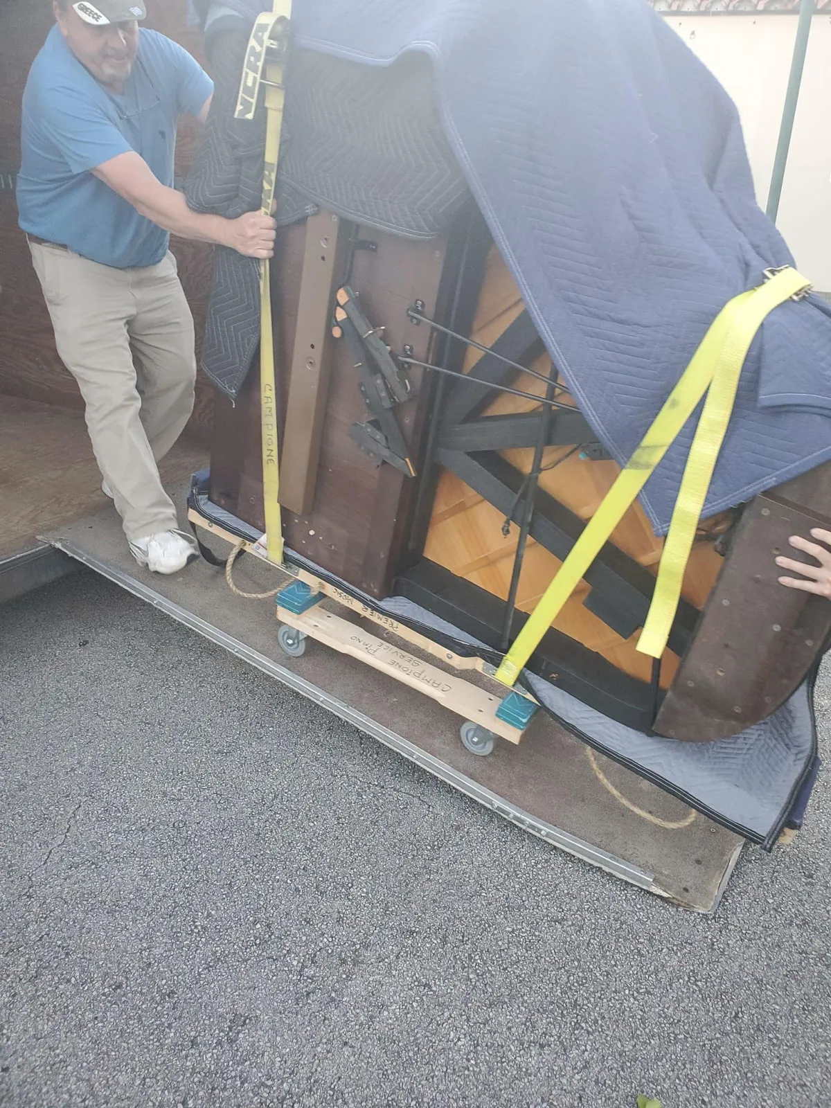 Inside of a grand piano reveals strings and structure.