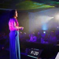 Tania Davies presenting The Strategic Slow Down keynote on stage