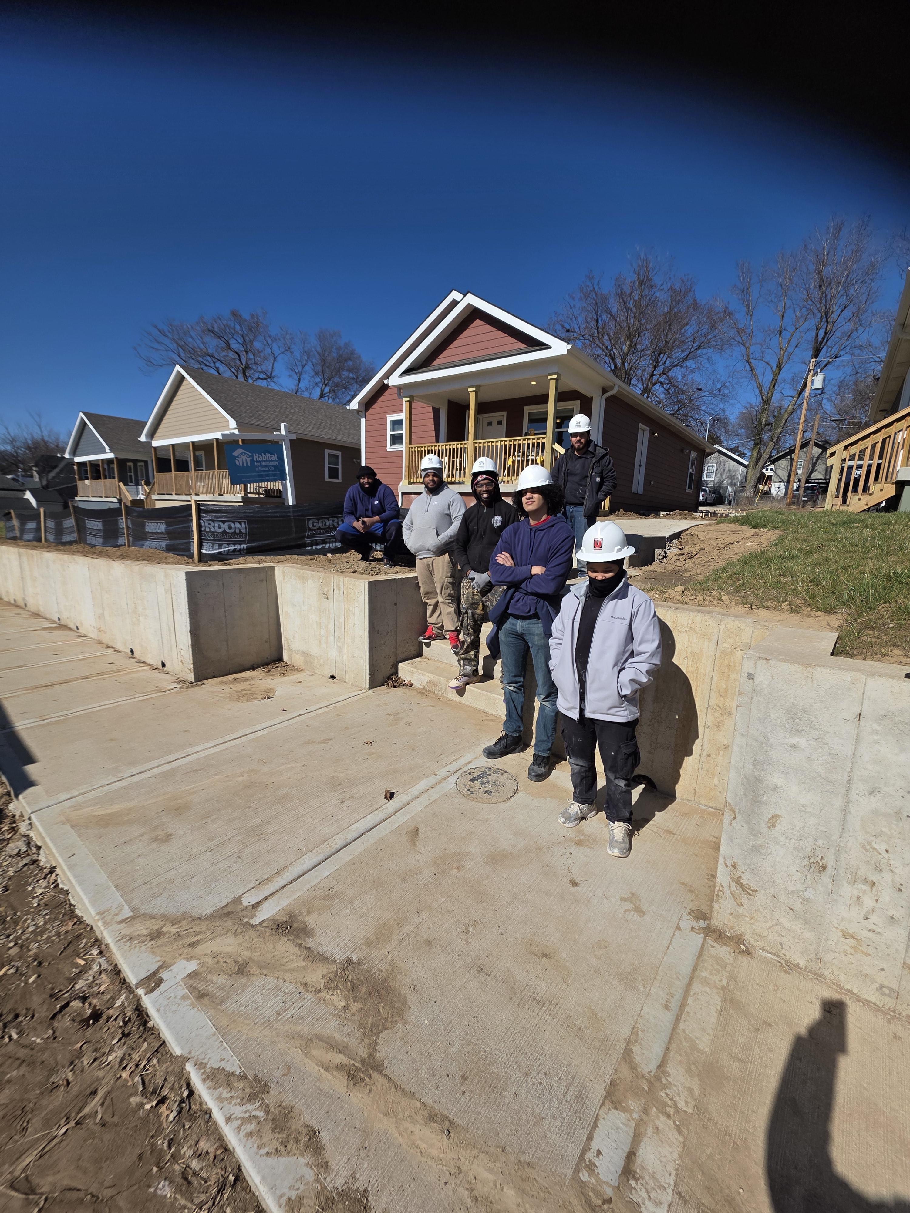 SWD participants and staff standing together at a job site in Kansas City