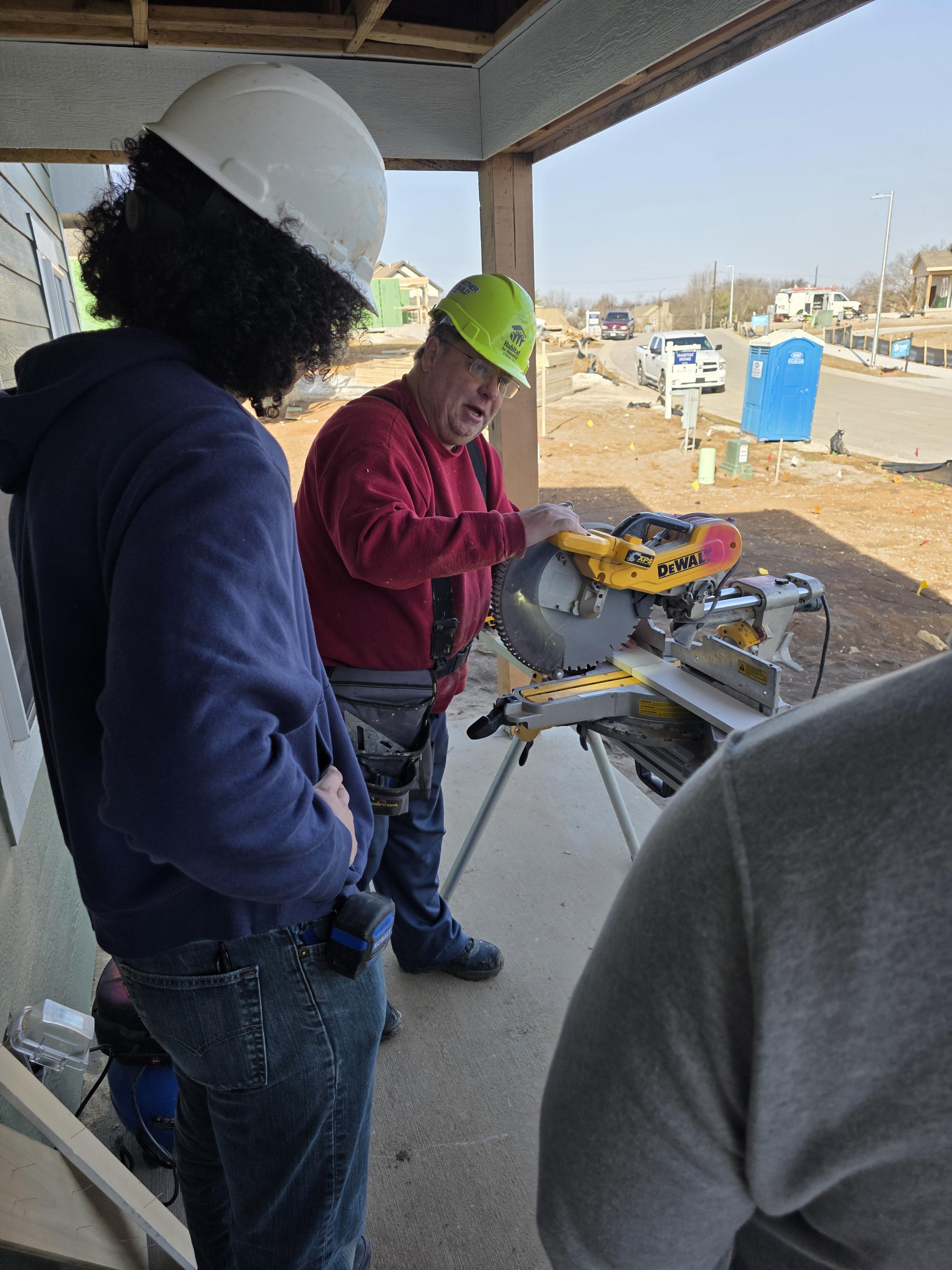 Participants in hard hats training on a construction site