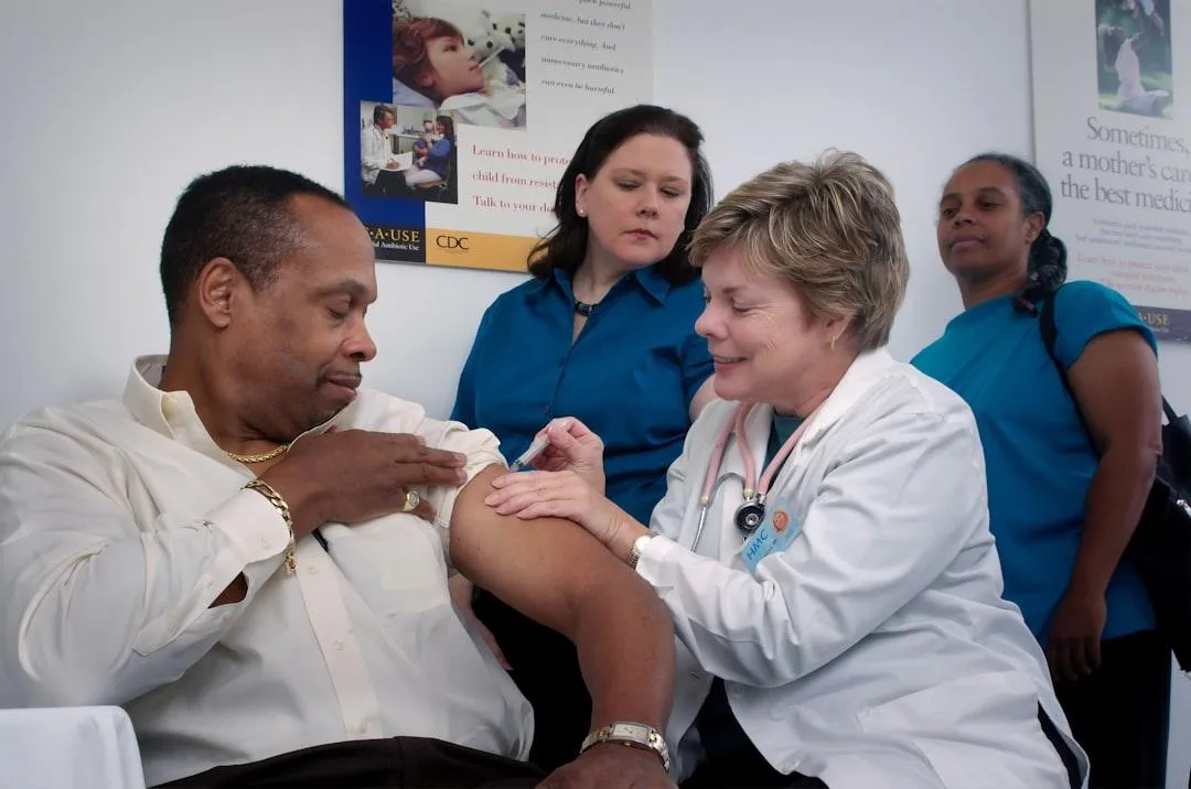 Elderly doctor with stethoscope in a clinic