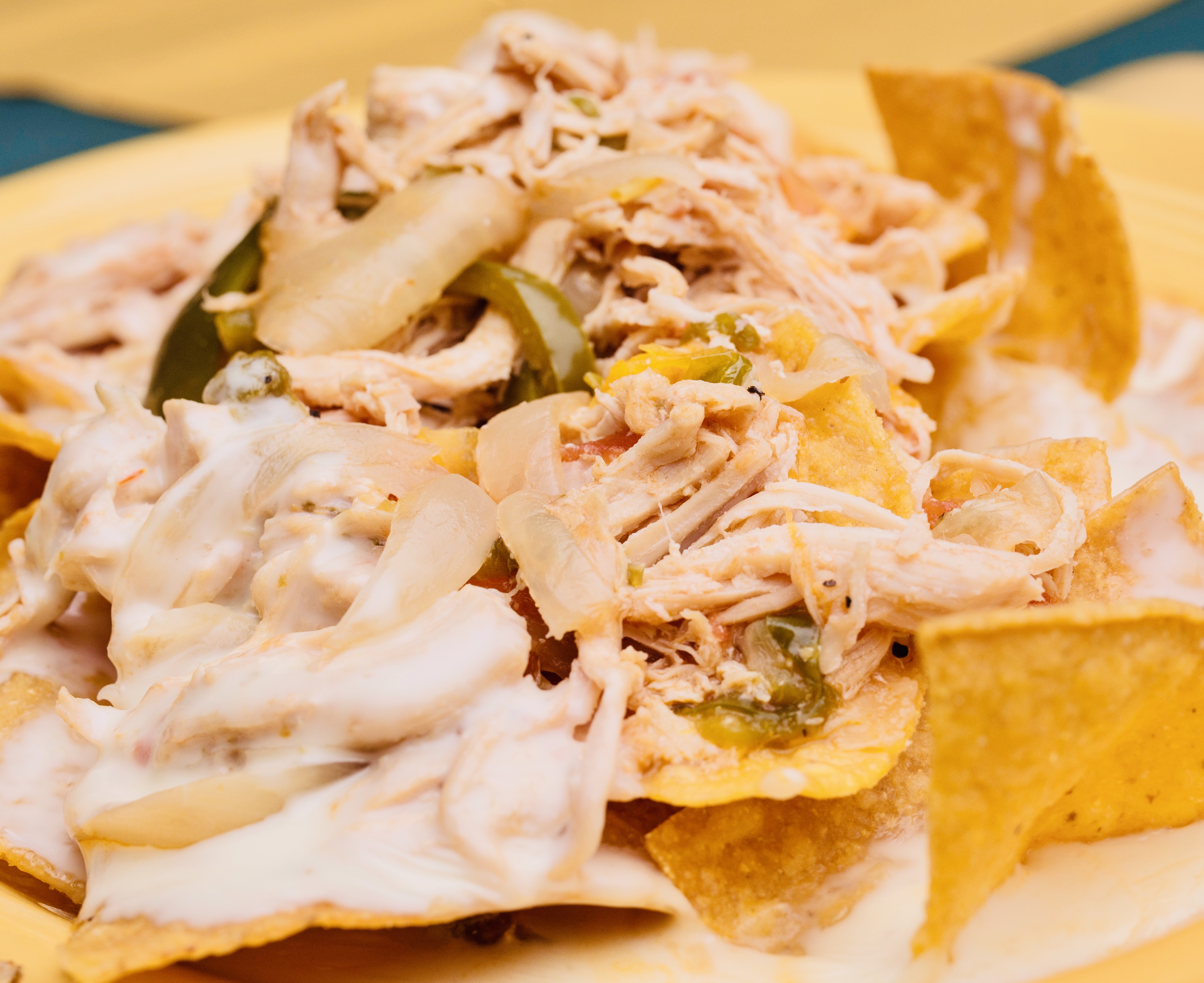 Plated fajita served with warm tortillas in a woven basket, colorful pico de gallo in a ramekin.