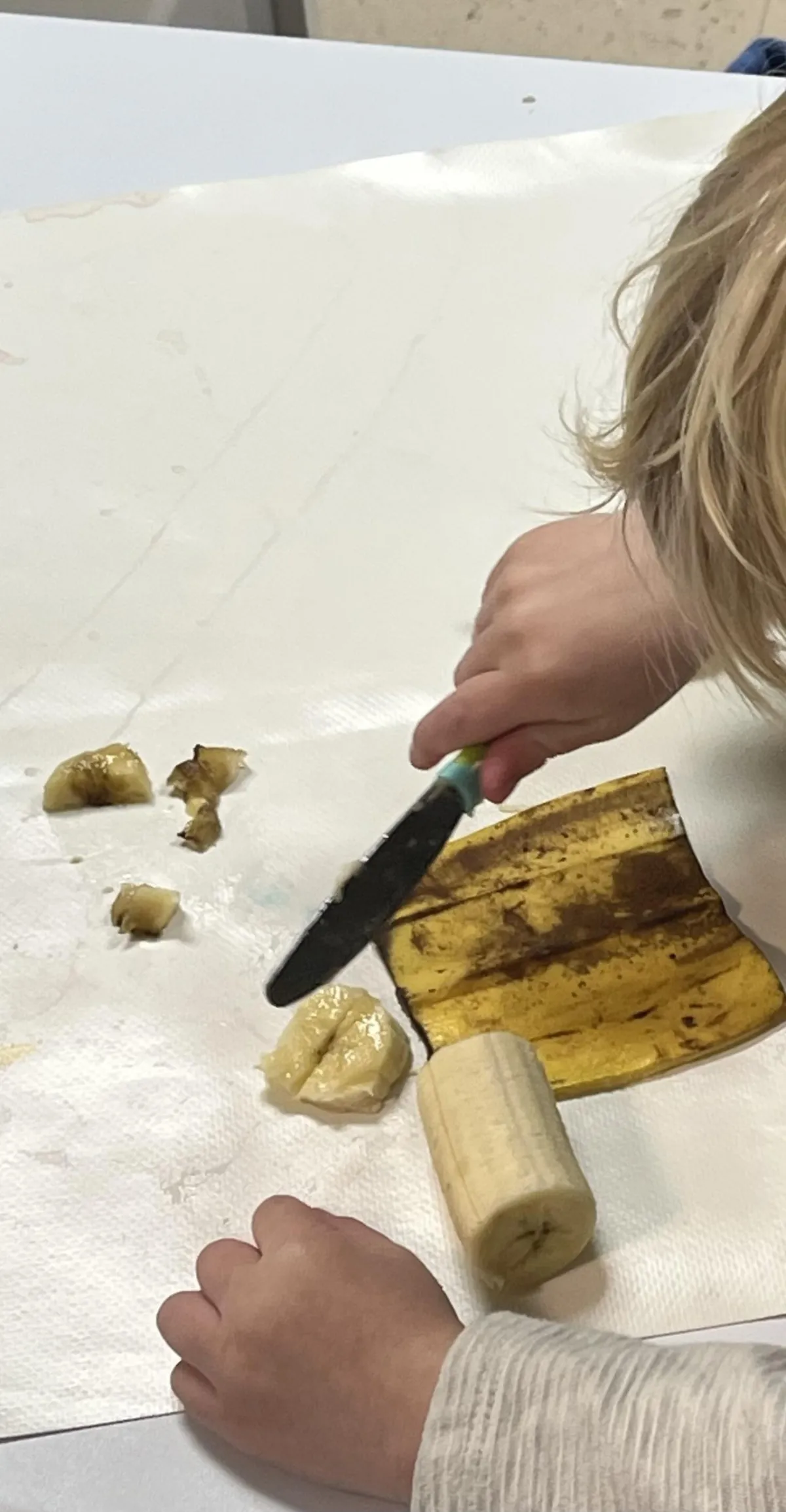 Girl follows directions during arts and crafts time.