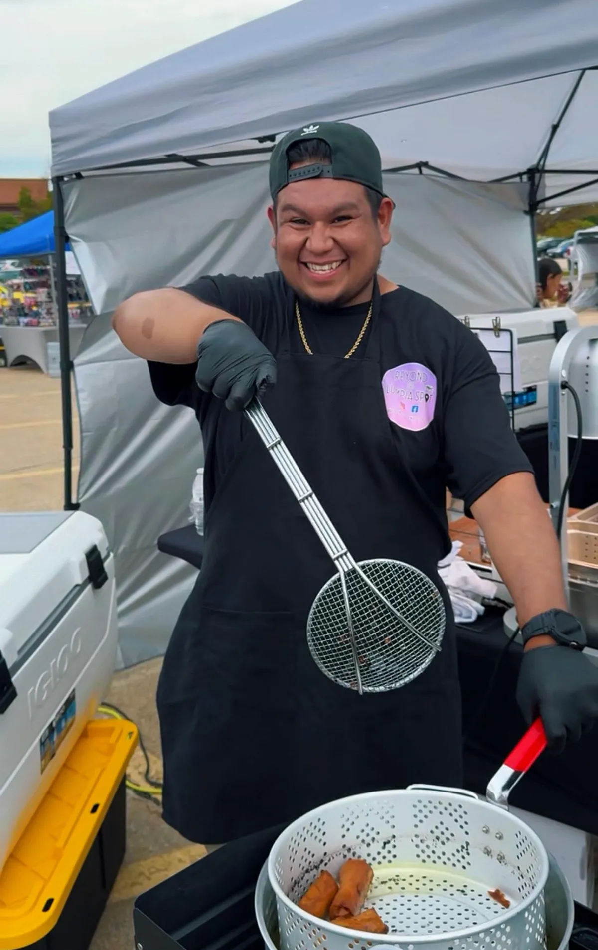 Chef Maya, Filipino-American woman, chef coat, smiling, tropical kitchen background