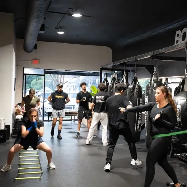 Members training in a BoxingRX group class