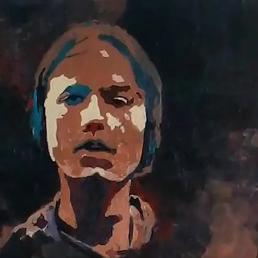 A man working on a piece of wood