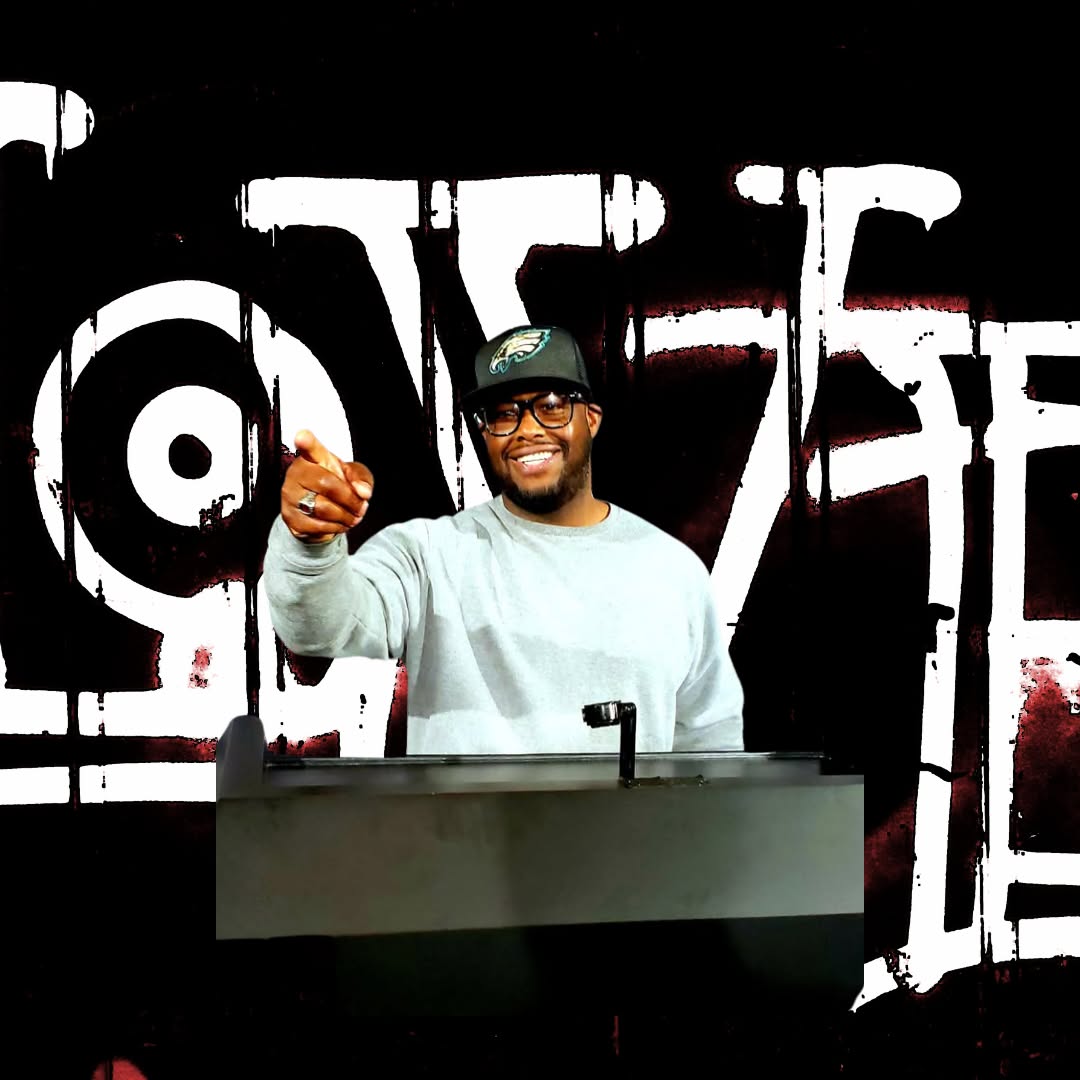 Coach Wes standing in a simple studio, relaxed posture, casual shirt, warm side lighting, neutral dark backdrop.