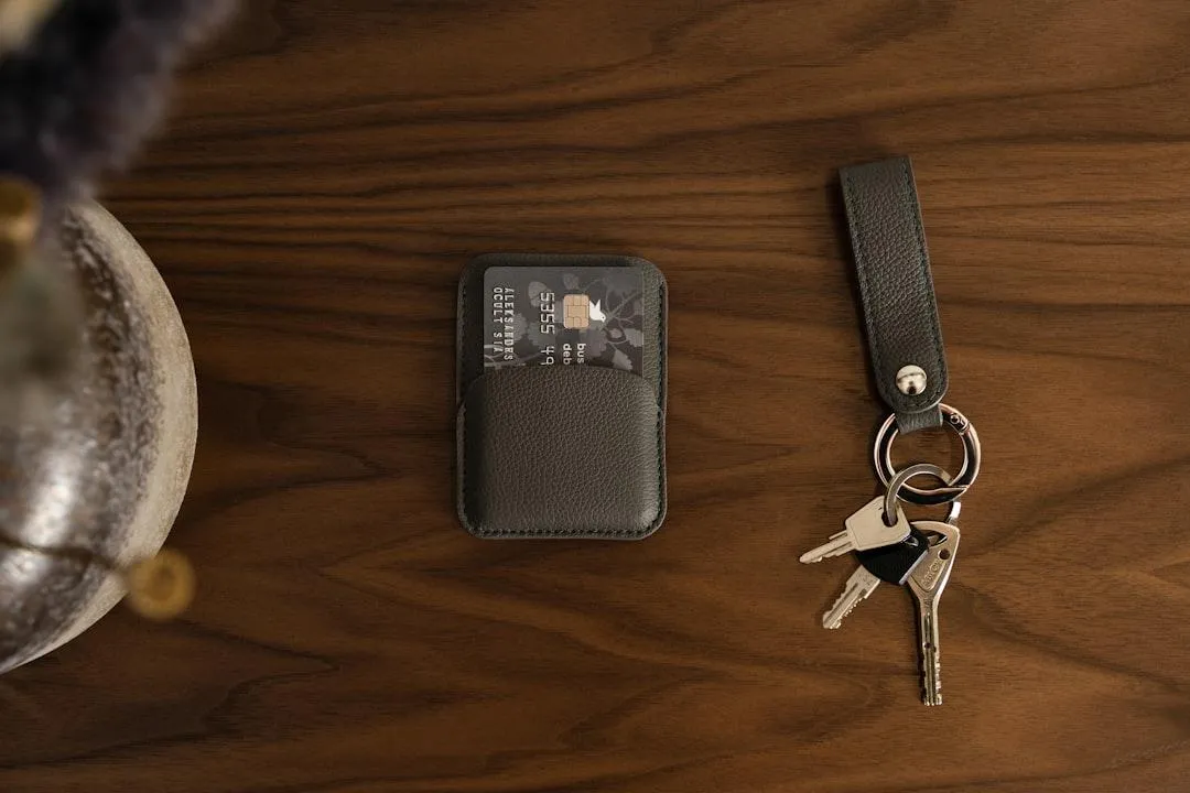 house keys next to wallet with credit cards