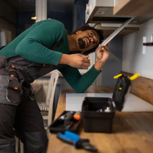 Austin Handyman installs electrical outlet.