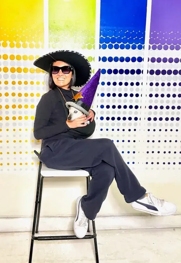 Jane Vaughan and a dog on her lap