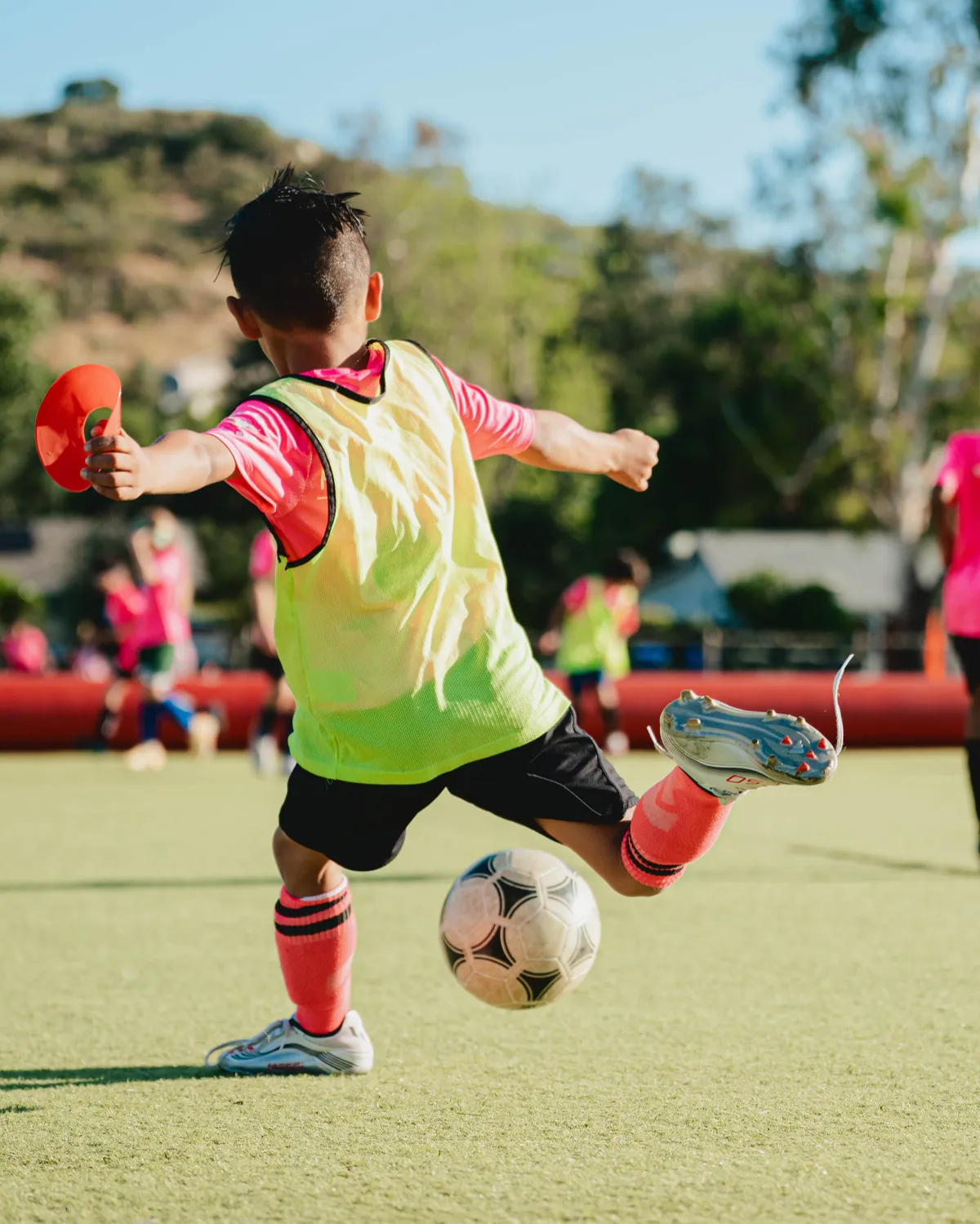 A Soro Futbol Academy player in focused individual training