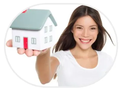 Woman holding a small house