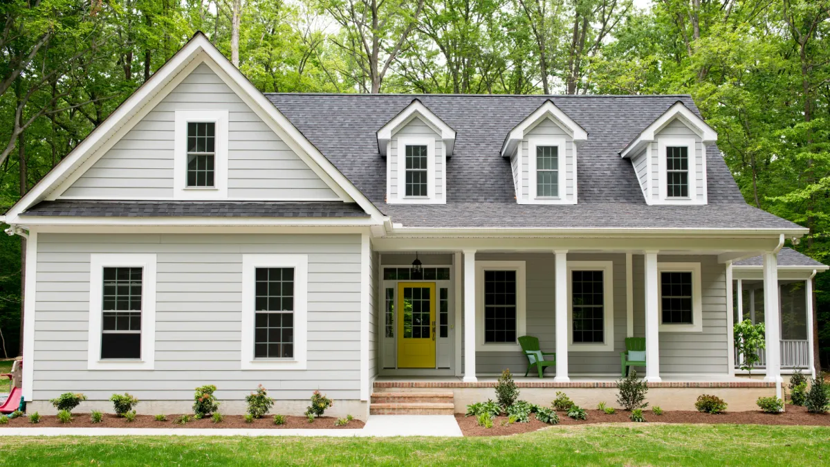 A nice 2 story home with some woods in the backdrop in South Carolina.