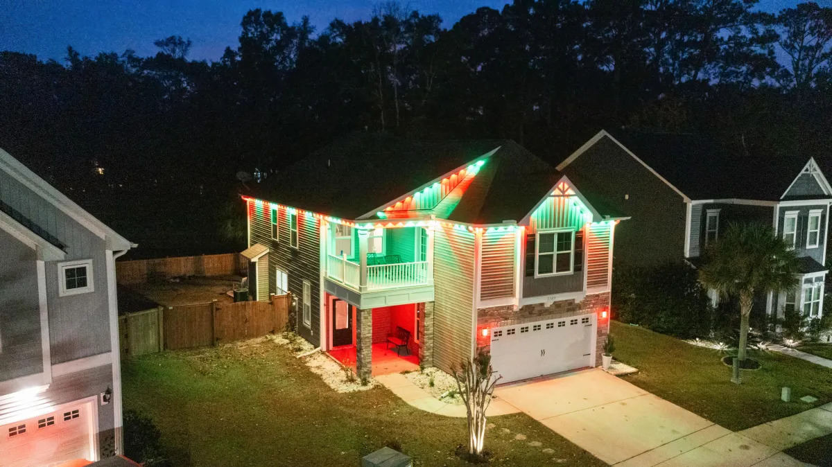 House with Govee Permanent Lights in vibrant red and green, showcasing seamless integration of outdoor lighting with the Govee smart ecosystem.