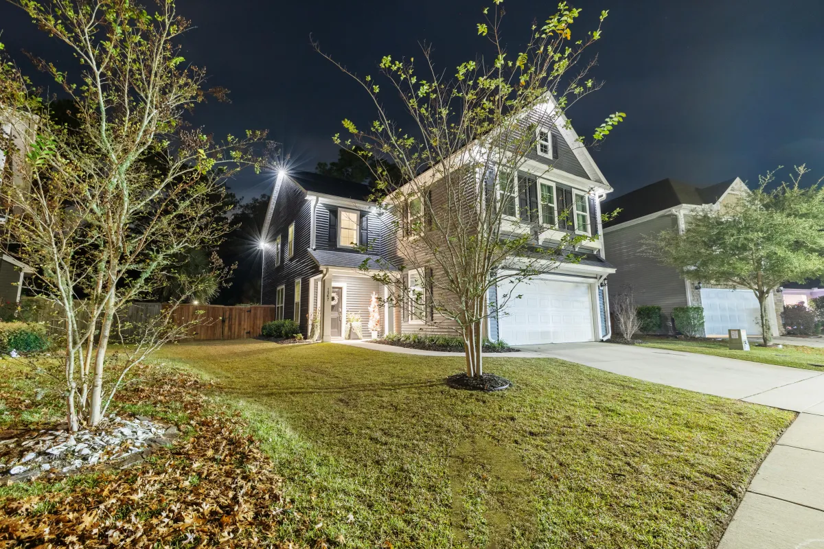 Subtly illuminated home with EverBright Permanent Lights highlighting the front yard and driveway, enhancing security and nighttime visibility