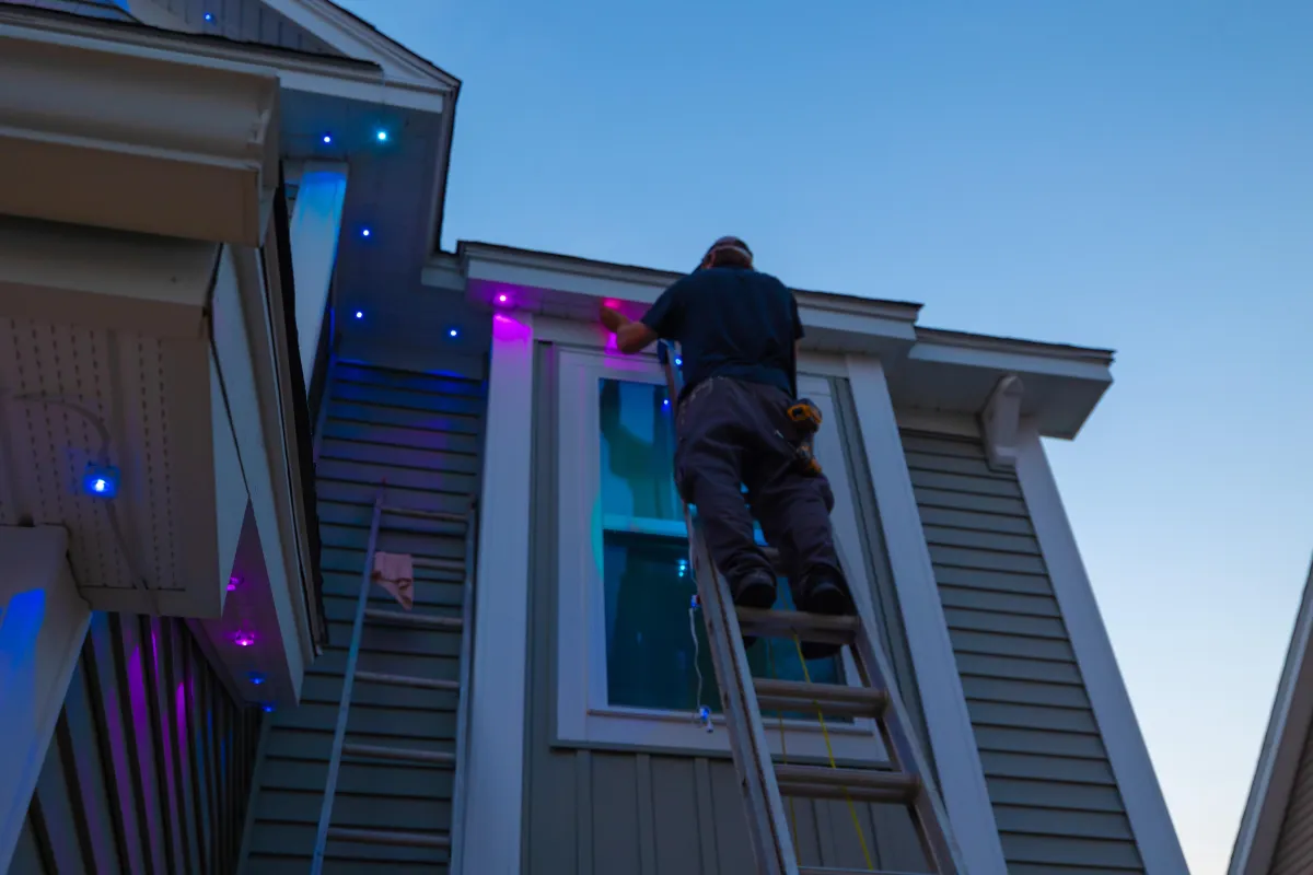 Professional installation of EverBright Permanent Lights on a home, featuring concealed wiring and seamless integration with the home’s exterior.