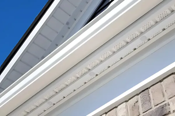 Close-up view of a home’s soffit and fascia featuring discreetly installed permanent LED outdoor lights with a clean, seamless design.