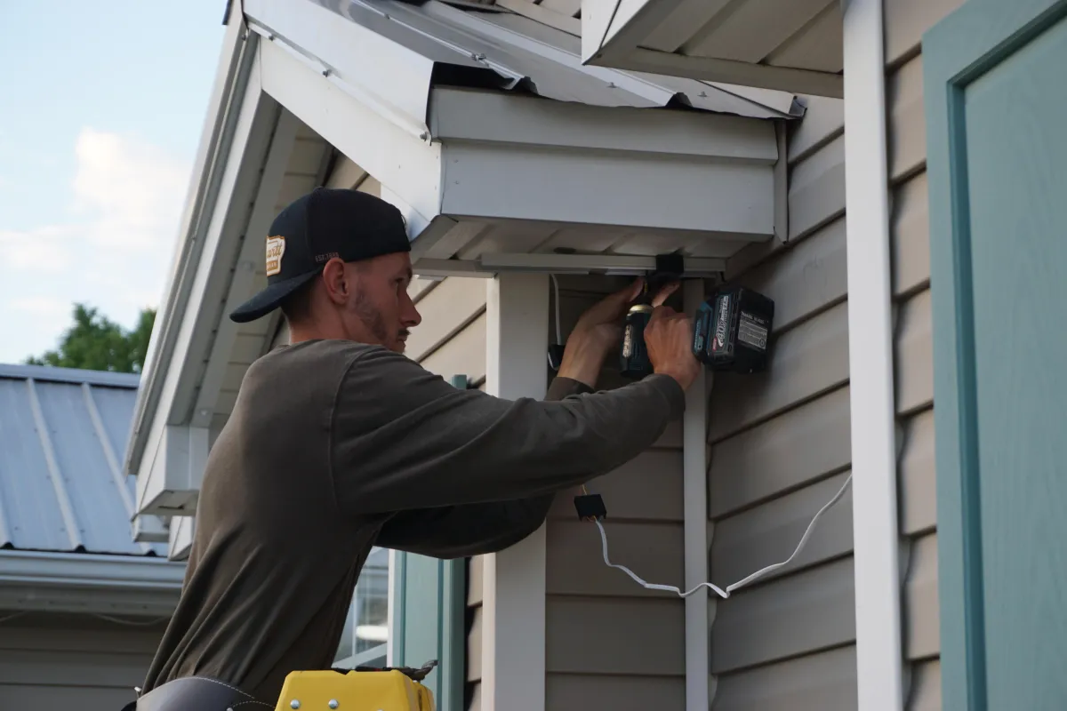 Professional installation of EverBright Permanent Lights on a home, featuring concealed wiring and seamless integration with the home’s exterior.