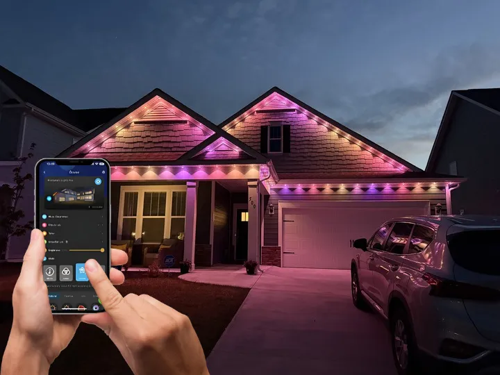 House lit with vibrant pink and white Govee Permanent Outdoor Lights, highlighting the convenience of schedule automation and remote lighting control.
