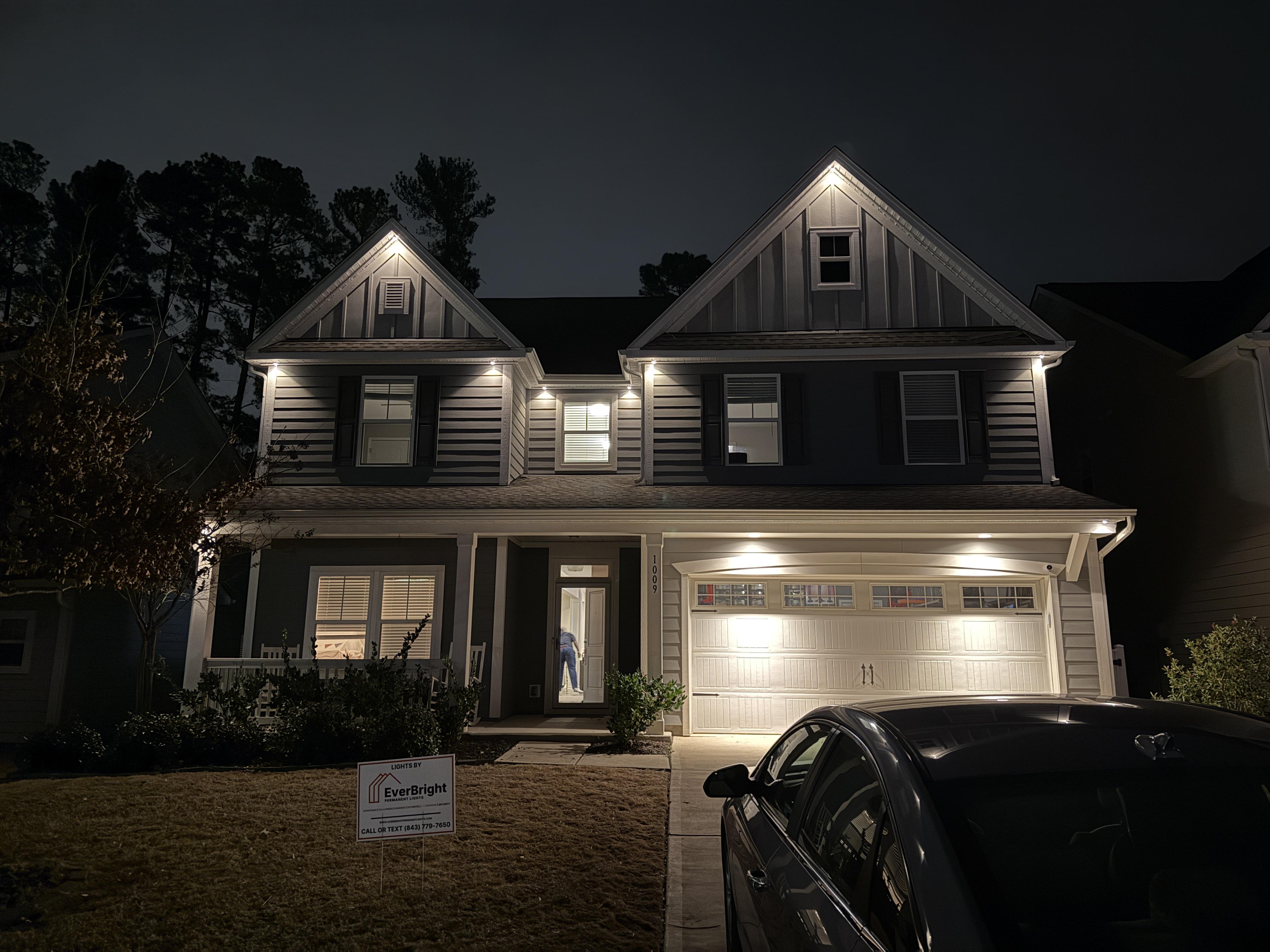 Subtly illuminated business with EverBright Permanent Lights highlighting the front yard and driveway, enhancing security and nighttime visibility