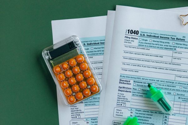 Tax forms with calculator and highlighter