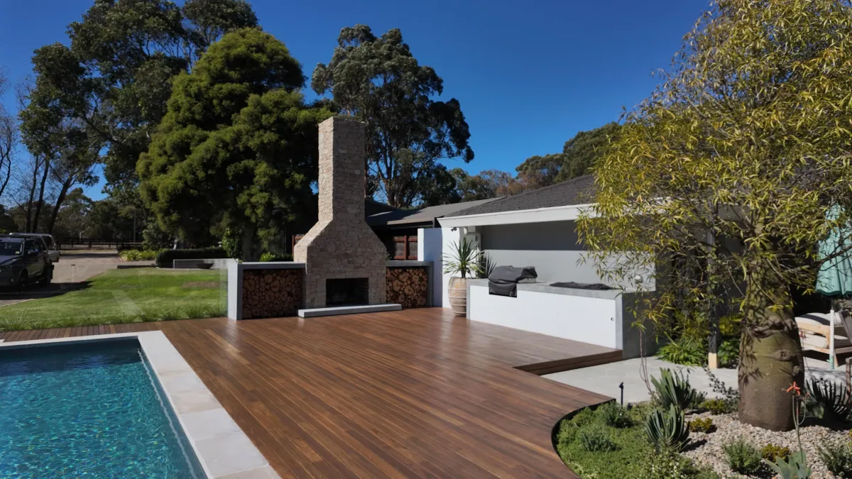 A beautiful, ornate garden with a golden statue.