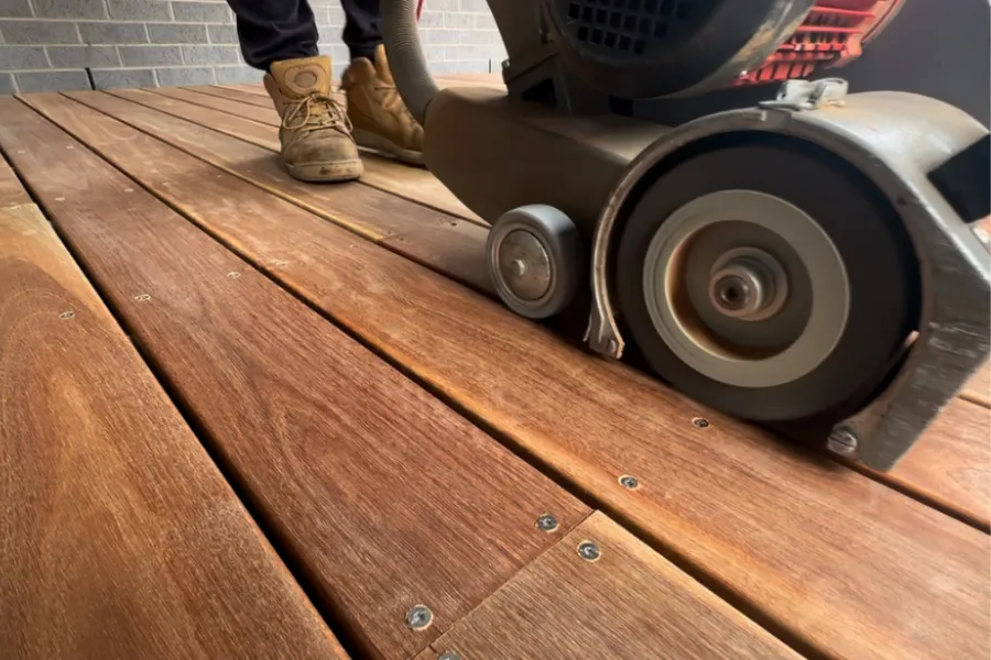 three people planting flowers