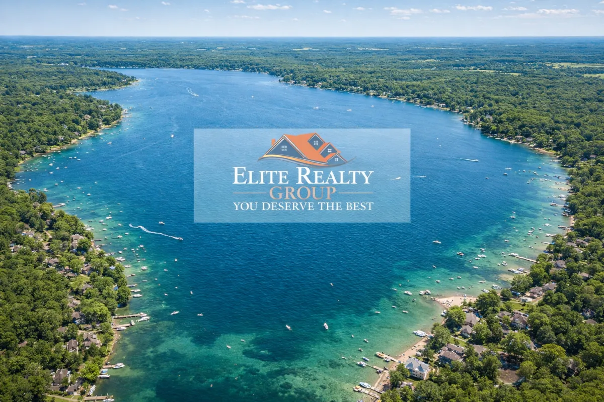 Aerial view of Richland, MI showing tree-lined streets, homes, and a bustling town center on a sunny day