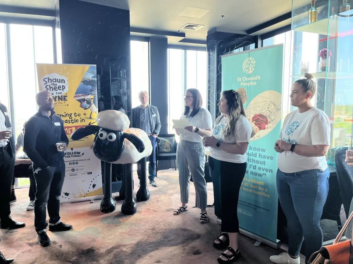 shallow focus photography of person holding camera lens