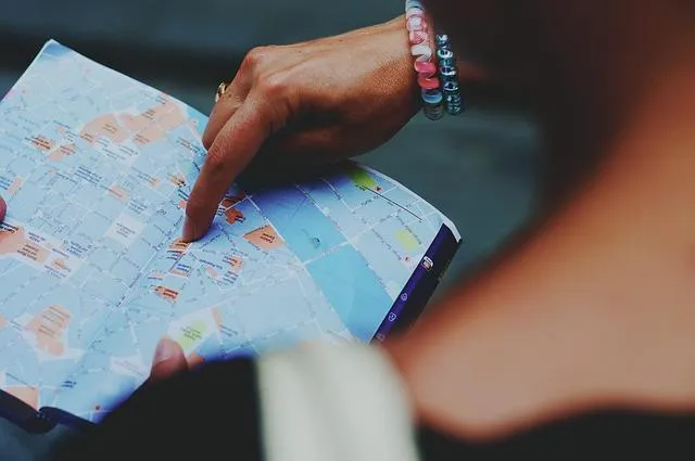 Someone pointing at a map to show the importance of having a plan