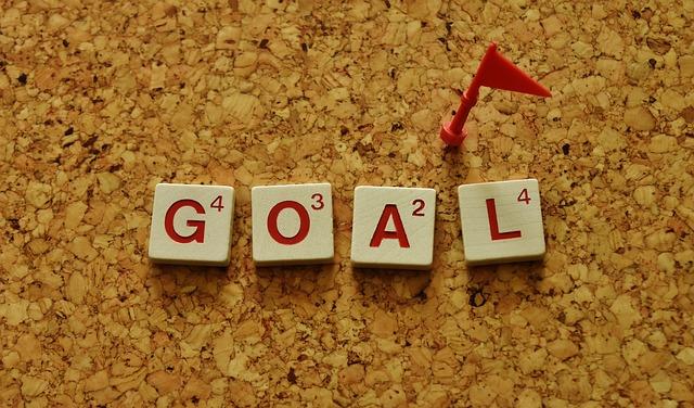 Scrabble tiles laid out to spell "Goal" 