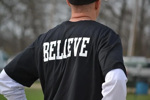 Someone wearing a t-shirt with "believe" written on it