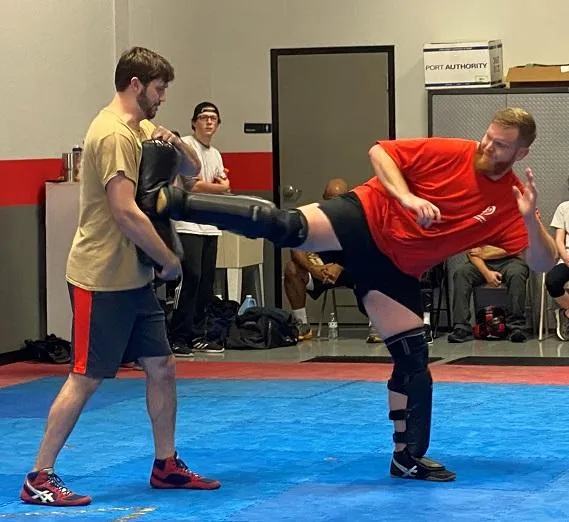 Student throwing side kick at Krav Maga Lake Norman