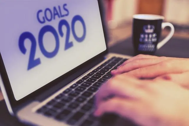 A computer showing a screen with goals 2020 on it to show the importance of performance coacvhing.