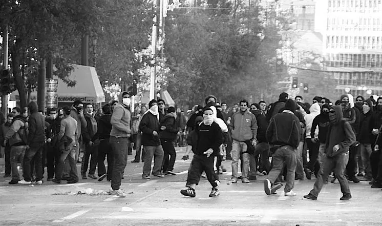Rioters wearing masks and bandanas gathering in a city.