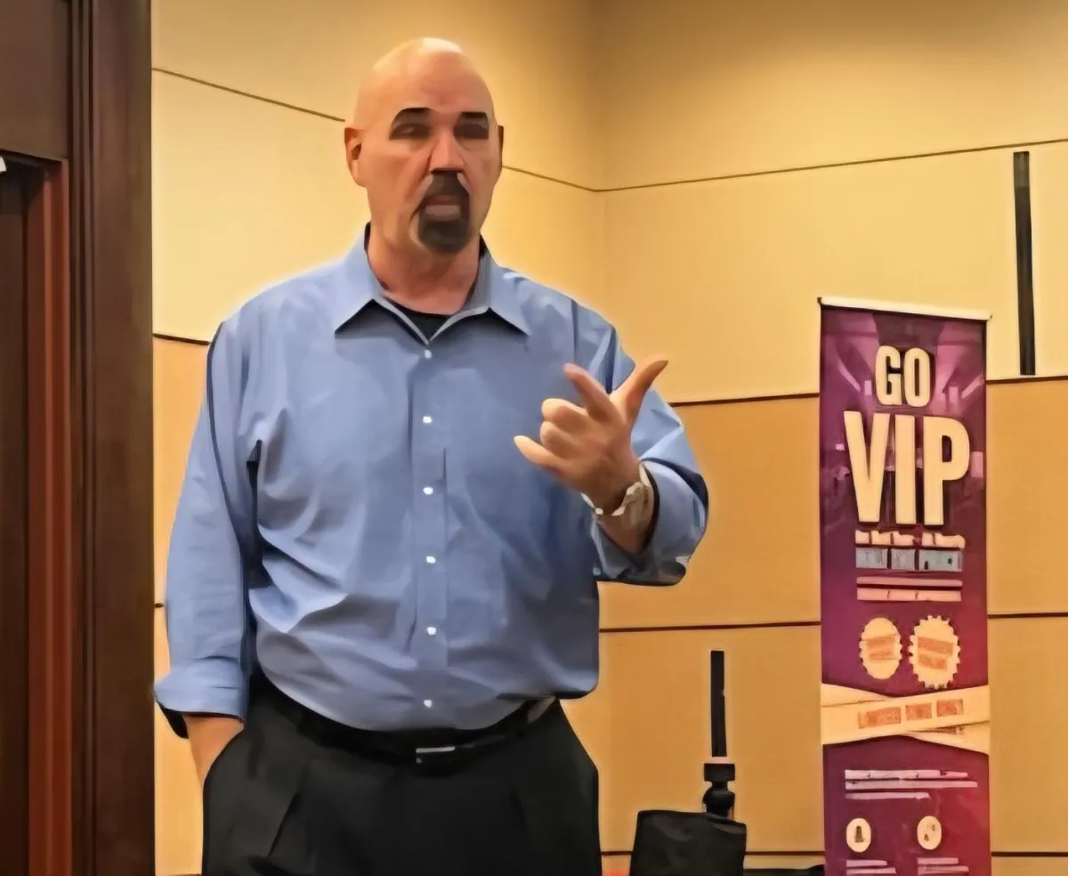 Nick Hughes speaking at a national conference on confidence and communication for small businesses.