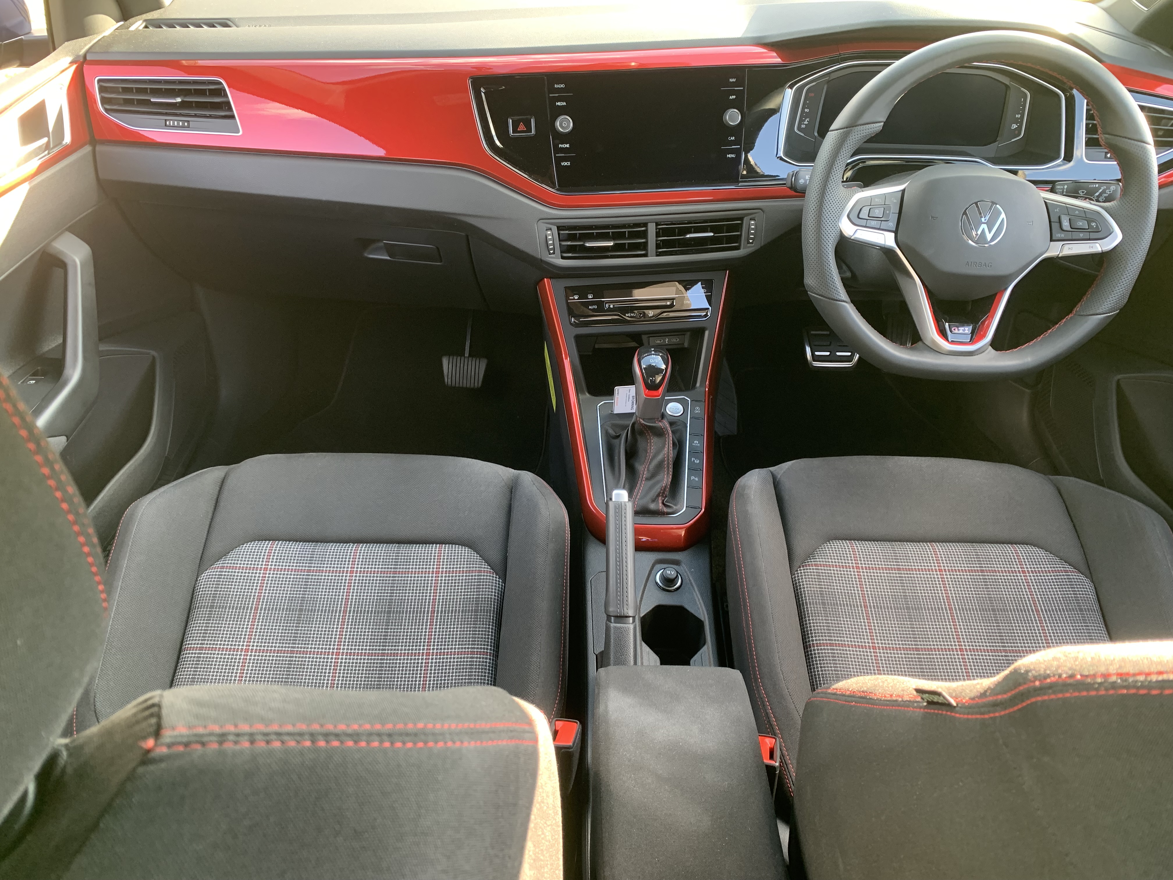 person holding black Honda car steering wheel