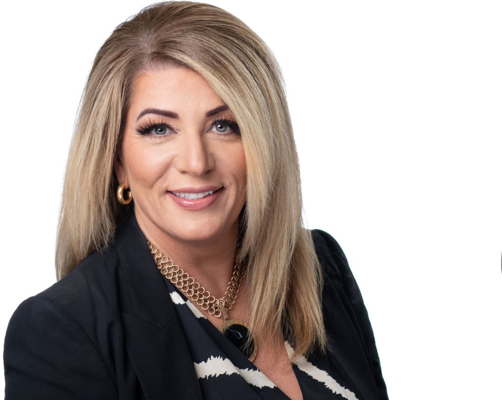 A man sitting at a desk writing on a piece of paper