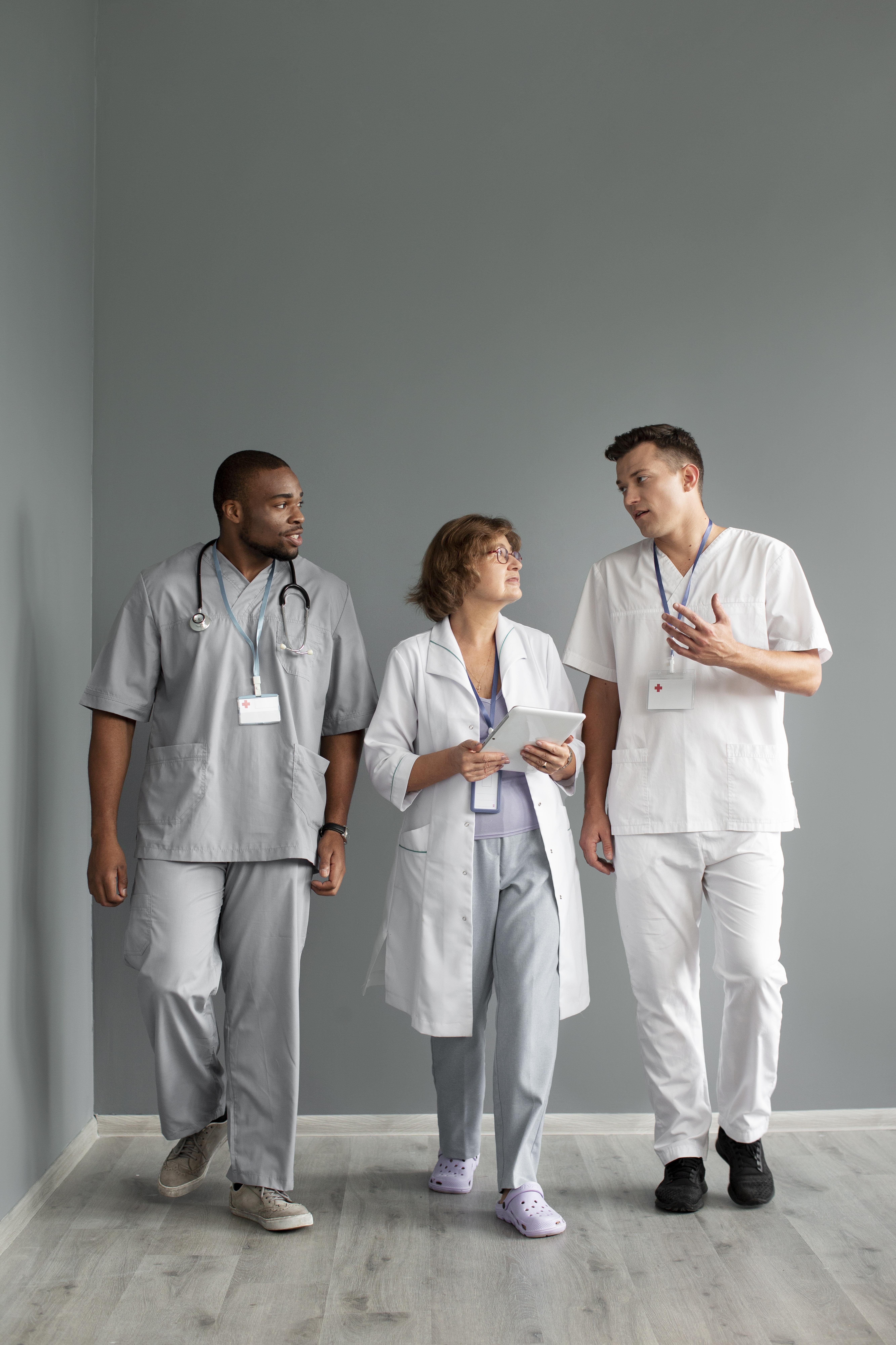 Healthcare professionals collaborating in a clinical setting supporting mobile preventive health screenings and workplace wellness programs.