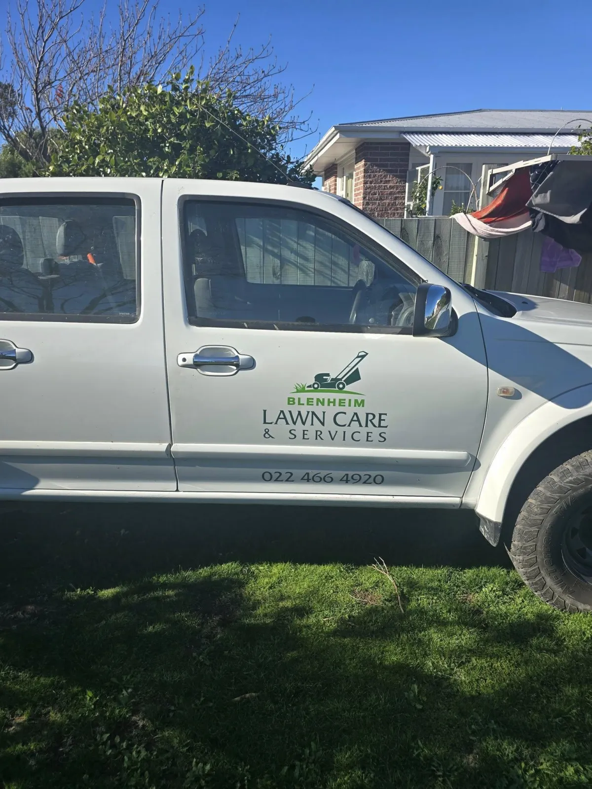 Nikau Wilson and Blenheim Lawncare team working outdoors