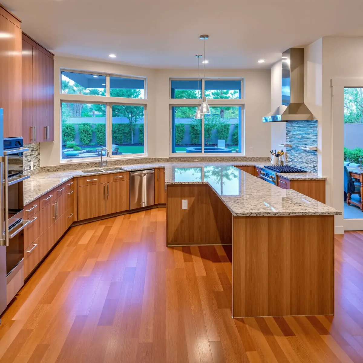 Beautiful renovated West Grove Valley, CA kitchen with modern wood cabinetry, marble counters, high-end appliances, and natural light.