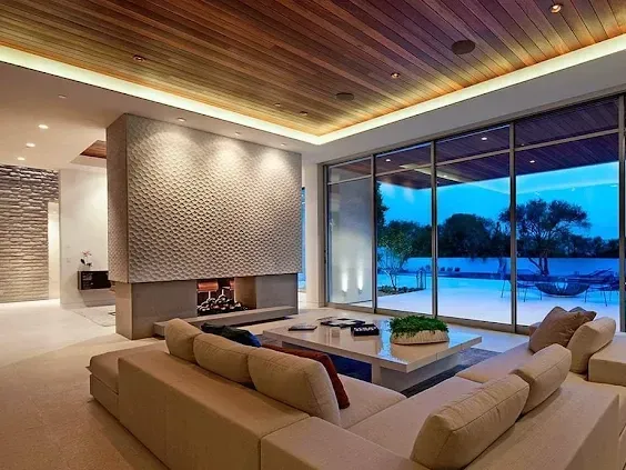 Contemporary Los Angeles kitchen with sleek cabinets, marble island, stainless appliances, hardwood floors, and modern design.