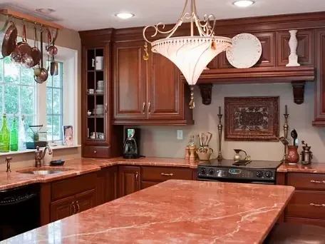Contemporary Los Angeles kitchen with sleek cabinets, marble island, stainless appliances, hardwood floors, and modern design.