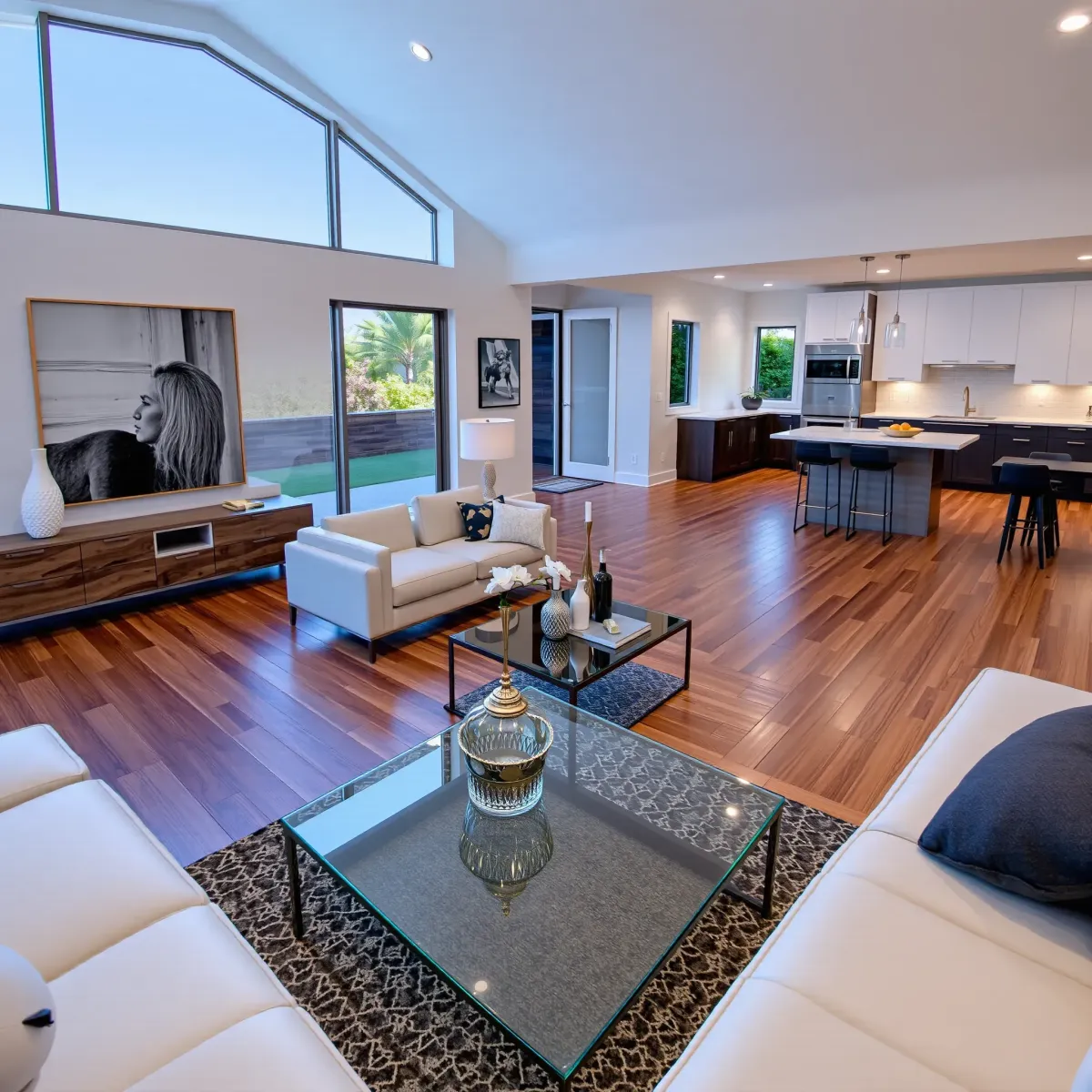Modern renovated Costa Mesa home interior with open living space, natural light, sleek kitchen, and ongoing remodeling elements.