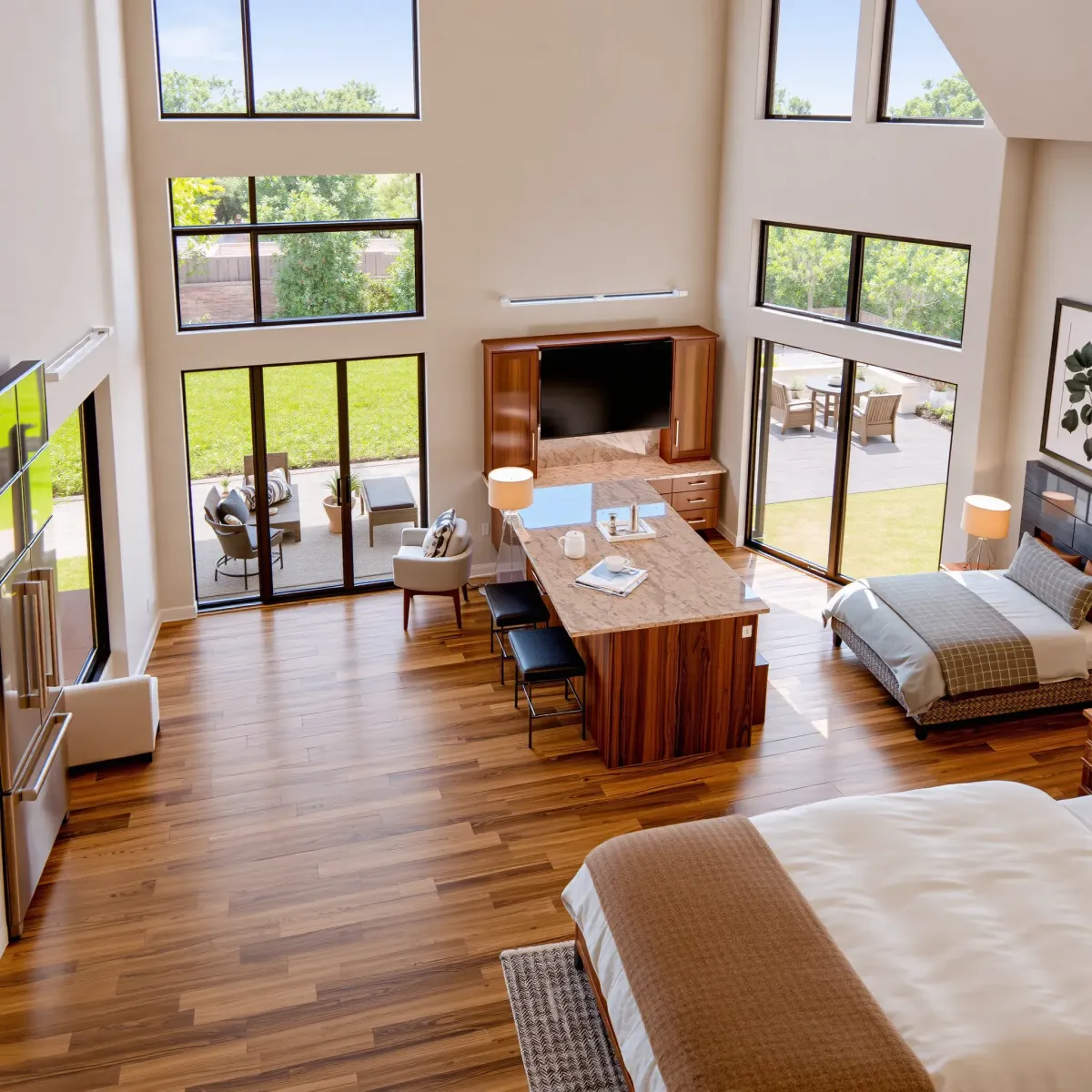 Beautiful remodeled Foothill Ranch home interior featuring open living, hardwood floors, modern furniture, stylish decor, and lush backyard views.