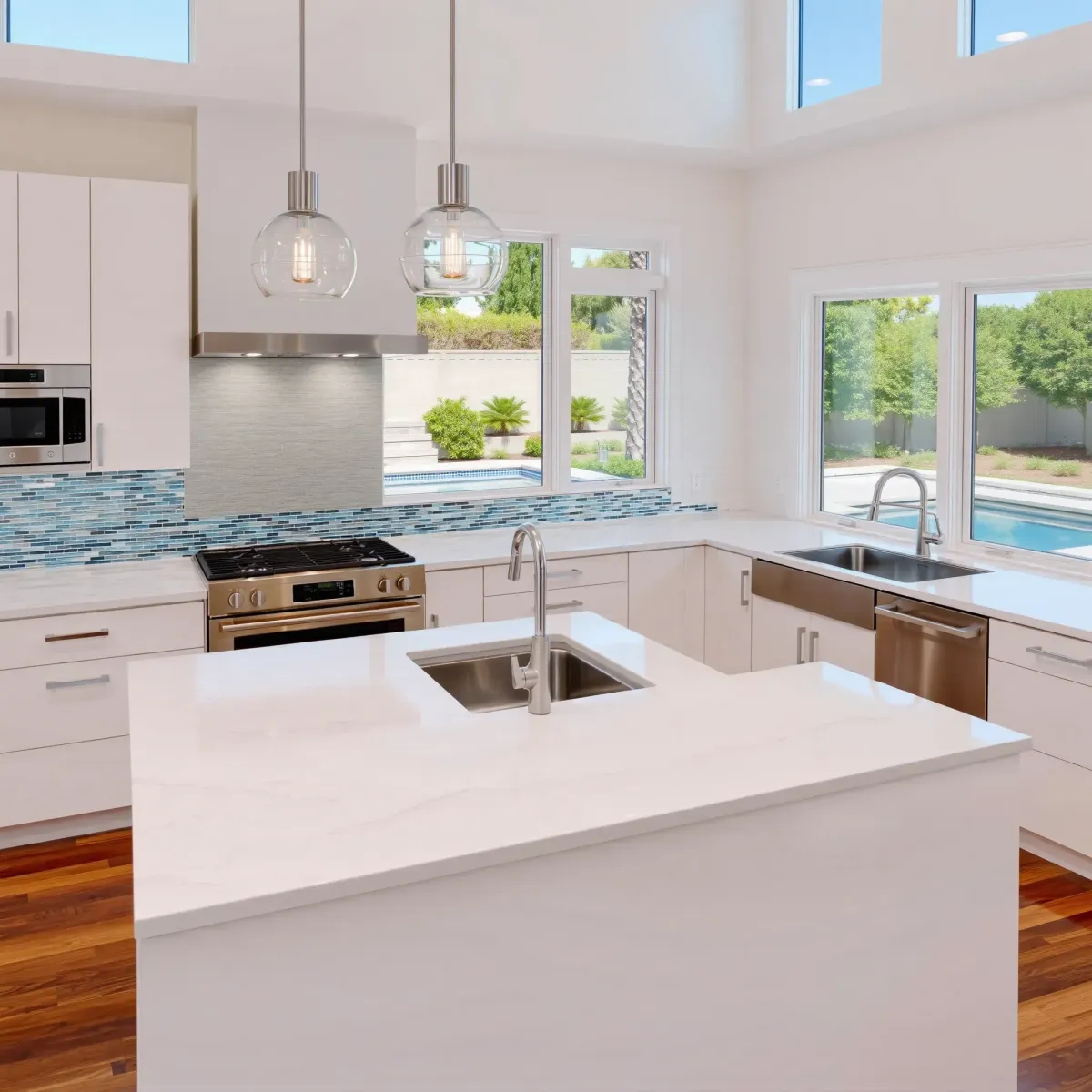 Remodeled Westminster, CA kitchen with quartz countertops, stainless steel appliances, wooden cabinets, and a marble island.