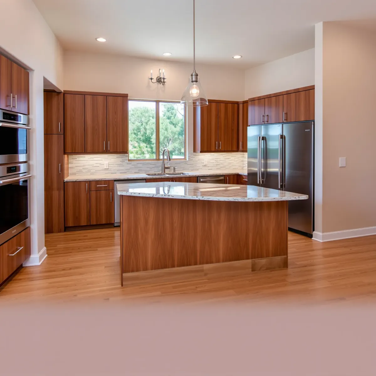 Remodeled Foothill Ranch kitchen with granite countertops, stainless steel appliances, custom cabinets, hardwood floors, and backyard view.