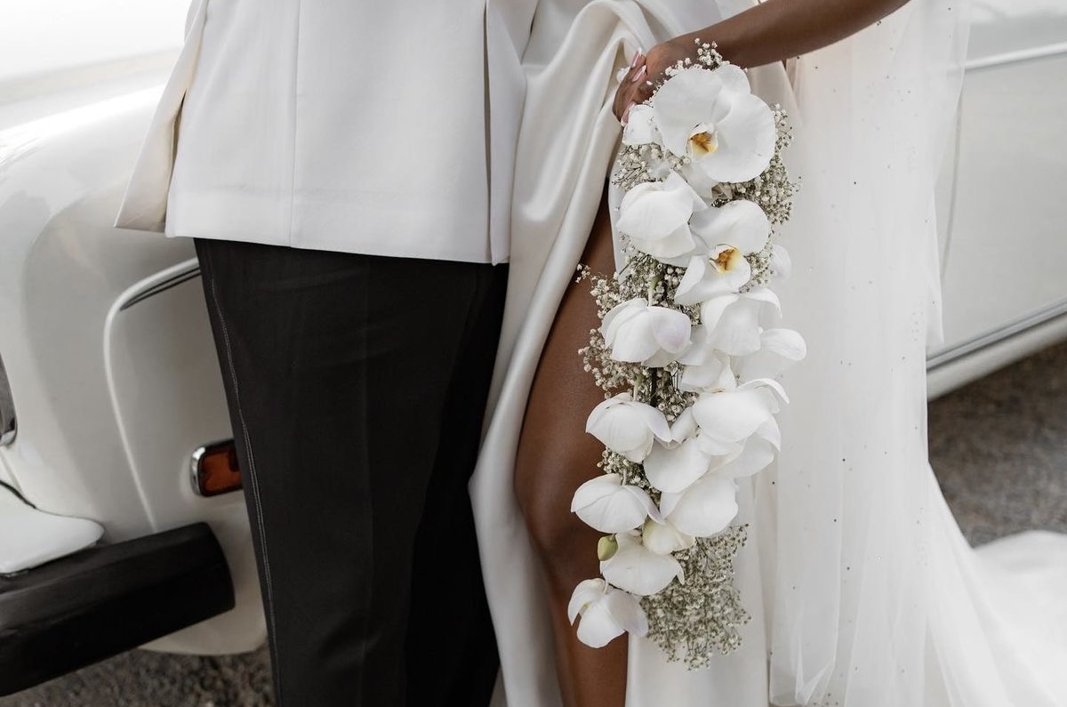 Couple holding hands at a table with names