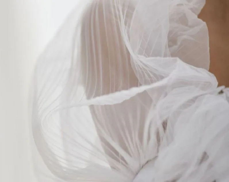 Table setting with plate, cutlery, and napkin.